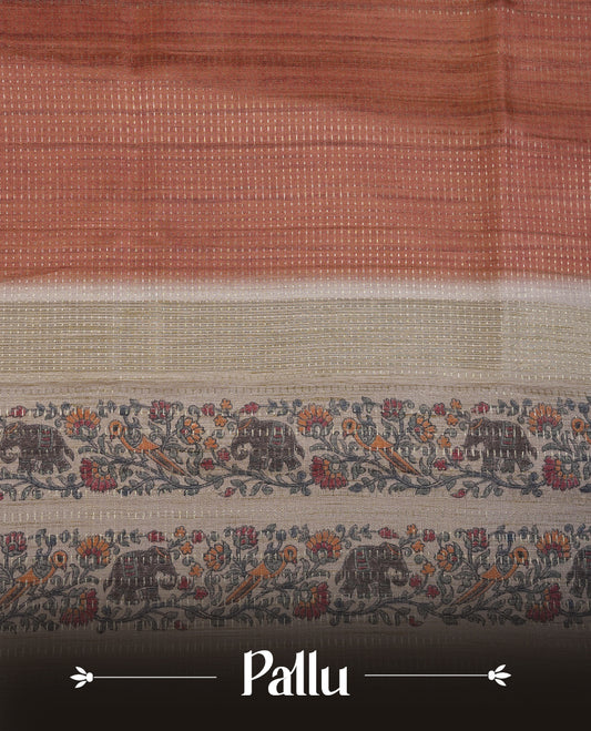 Brown colour tussar saree featuring golden zari dot stripped pattern on the body, complemented by a contrast cream colour mutlicolour floral kodi & animal print on border & pallu, paired with a matching blouse.