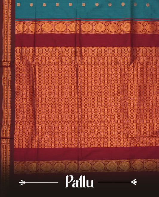Blue colour Kalyani Cotton saree in deep maroon with golden motifs, paired with a contrasting maroon border featuring intricate zari work & Comes with a matching blouse piece,