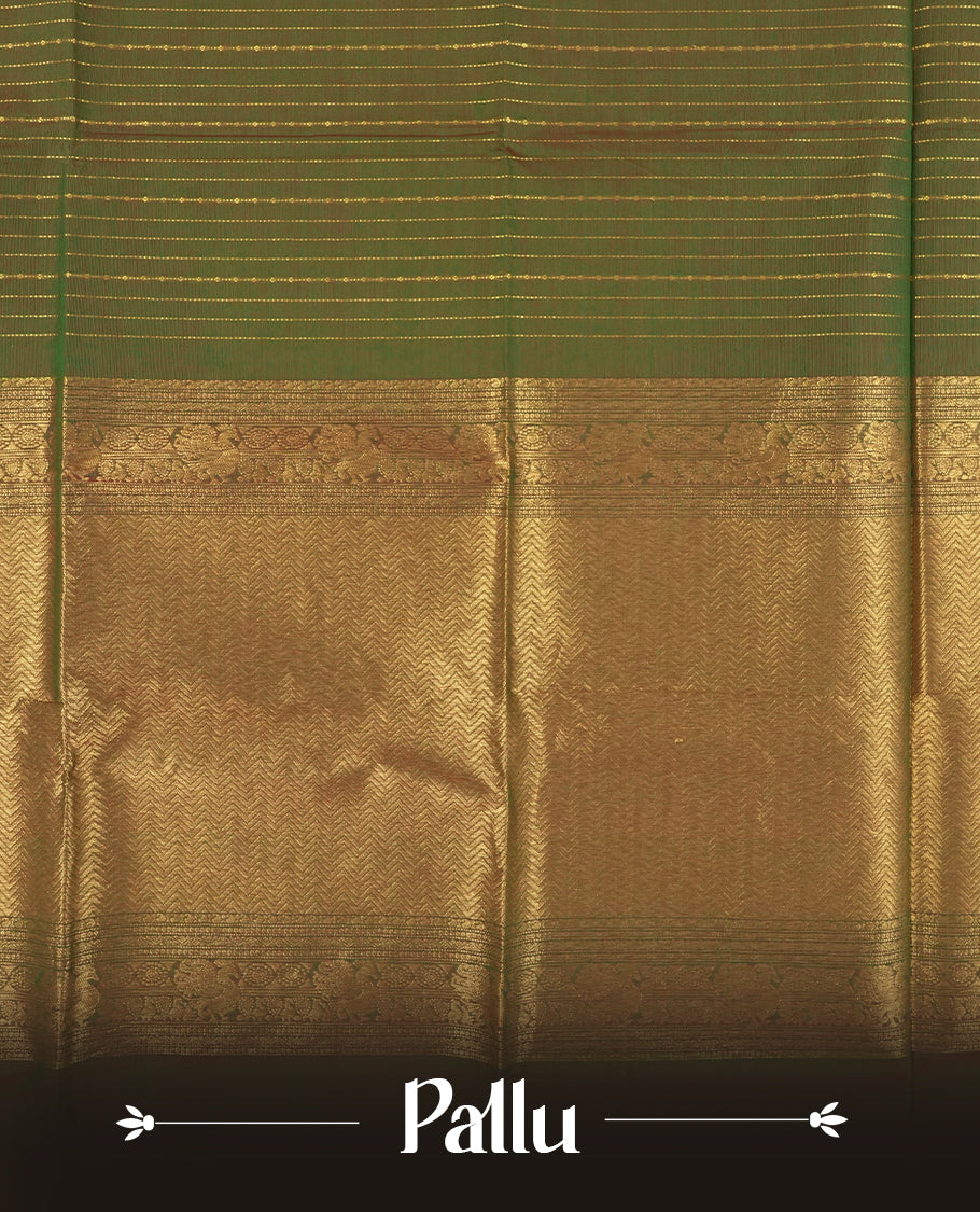 Green and magenta colour dual shaded Chettinad cotton saree adorned with delicate golden zari lines on the body, The rich magenta border features intricate floral and paisley zari motifs & Comes with a matching blouse piece.