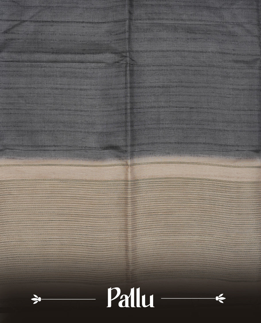 Gray colour semi tusser silk saree featuring contrast cream colour London bridge printed pattern border and paired with matching blouse.