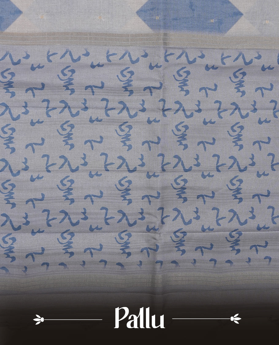 Steel blue colour semi tusser silk saree featuring geometric print pattern across body, gold zari border with style motifs and paired with matching blouse.