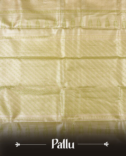 Golden green colour and rose gold Zari Tissue Brocade Saree features intricate floral Motifs on body and pastel green colour contrast  border with traditional border & pallu, paired with matching blouse