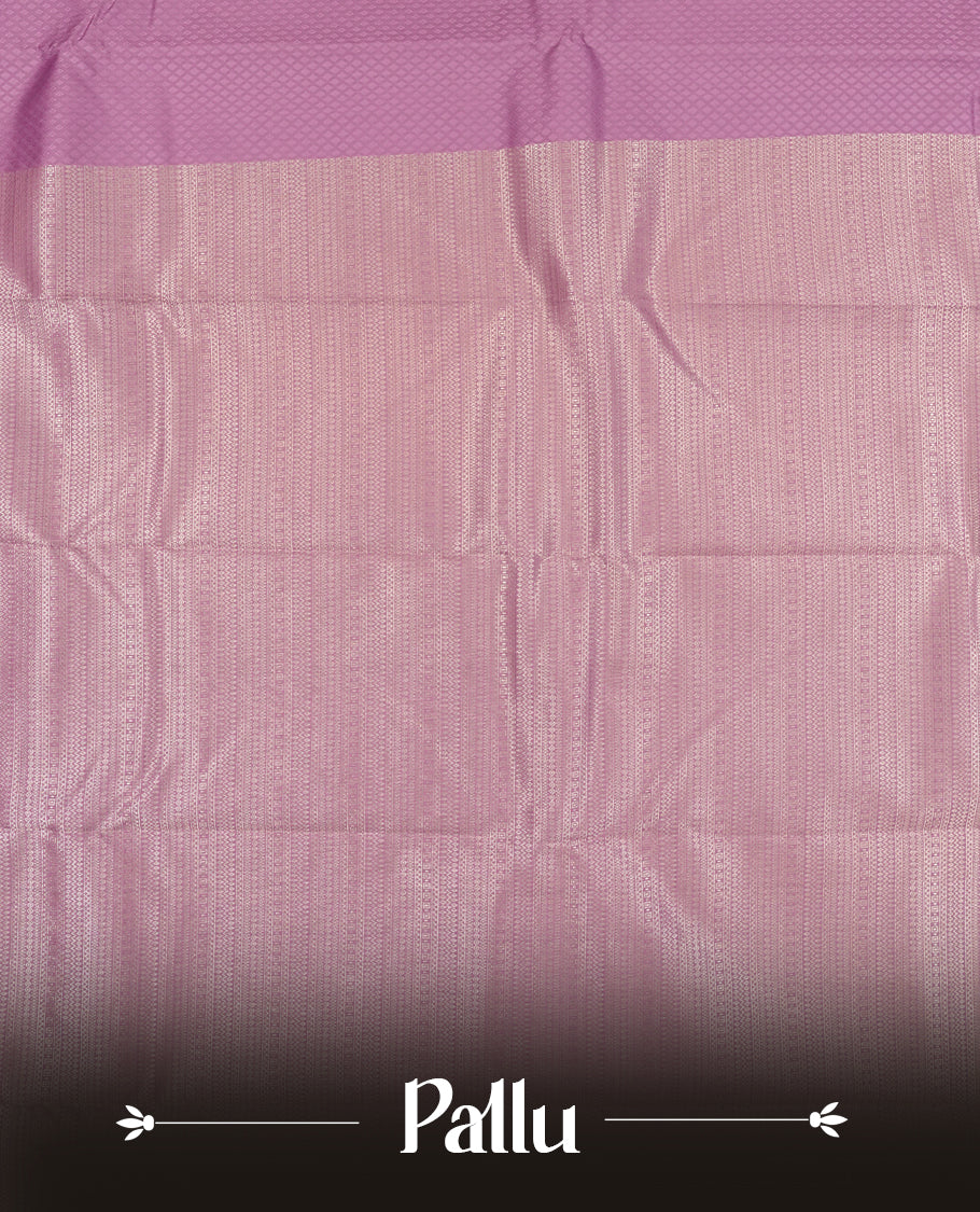 Purple Lavender colour semi soft silk saree featuring a self coloured textured patterned body, complemented by self coloured silver motifes on pallu & border and a matching blouse piece.