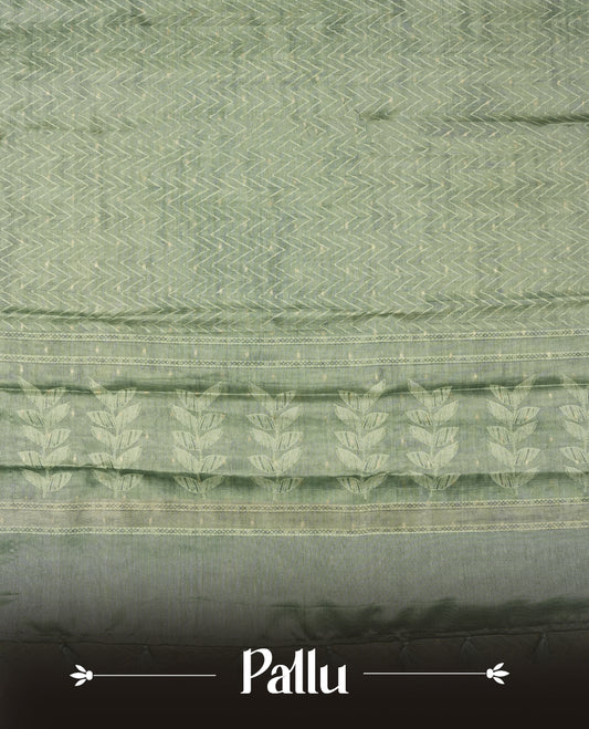 Sage green colour semi tussar saree adorned with Cream Zigzag printed pattern across the body and Leaf pattern on contrast Fern green colour border, paired with a matching blouse.