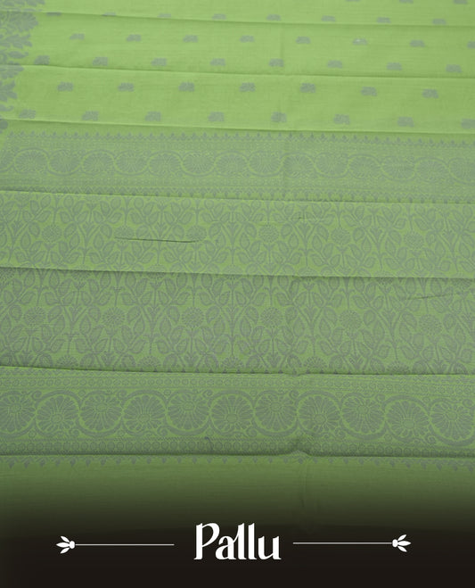 Moss green colour silk cotton saree featuring elegant floral zari motifs on the body, complemented by a rich contrast dark plain border and pallu with traditional woven detailing & Comes with a matching blouse piece.