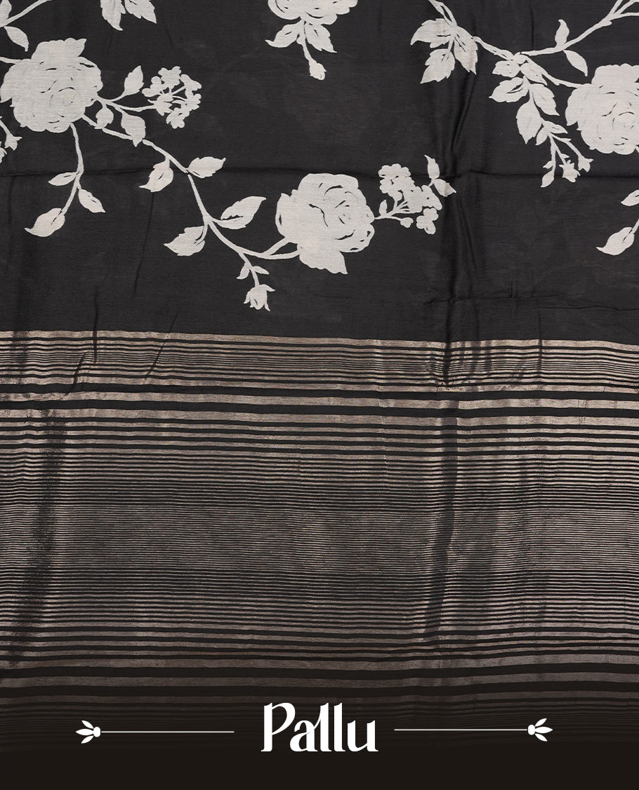 Black colour Viscos semi printed saree featuring a light golden zari border, abstract off white printed motifs on the body, and comes with a matching blouse