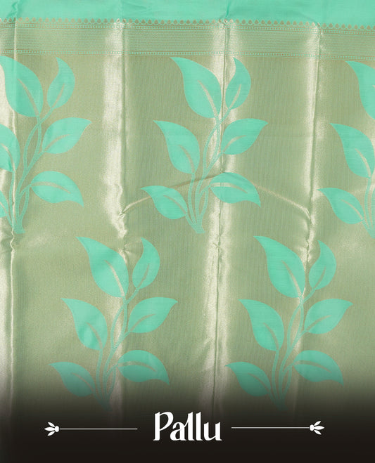 Mint green colour semi silk saree adorned with elegant floral motifs on the body, complemented by a shimmering golden zari-woven pallu and border, and paired with a matching blouse