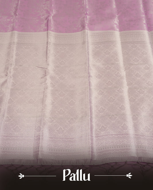 Light Lavender Colour Silk Saree with Allover Subtle Floral Self-Weave, Contrasting Silver Zari Woven Pallu and Border with Intricate Patterns and Tassels, Paired with Matching Blouse Piece