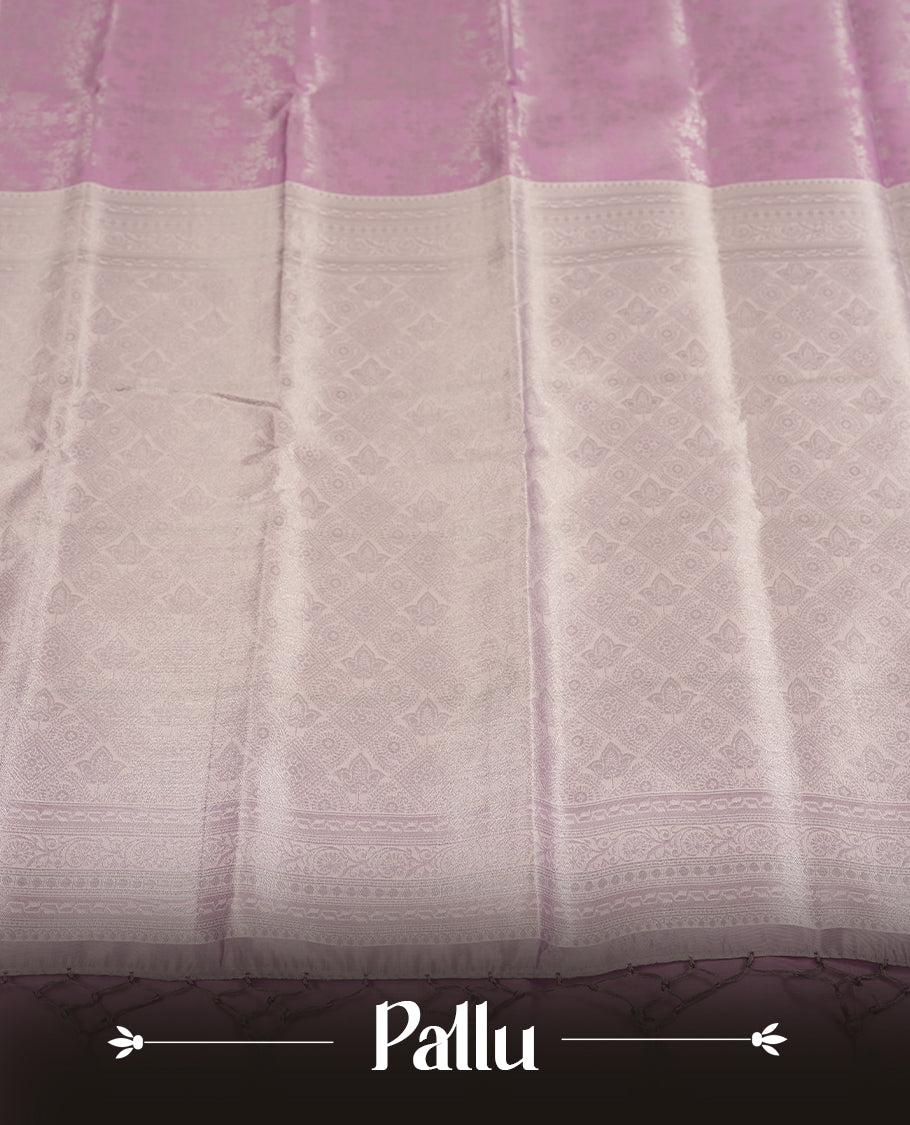 Light Lavender Colour Silk Saree with Allover Subtle Floral Self-Weave, Contrasting Silver Zari Woven Pallu and Border with Intricate Patterns and Tassels, Paired with Matching Blouse Piece