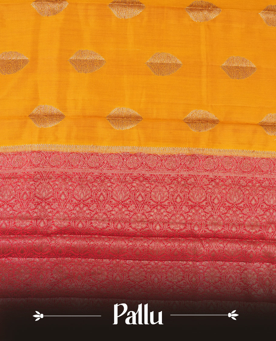 Golden Yellow Colour Banaras Soft Silk Saree with Gold Zari Oval Textured Buttas, Simple Decorative Pallu Border, Grand Pallu with Ornate Circular and Foliate Motifs in Red and Gold Tones, and Matching Red Blouse.