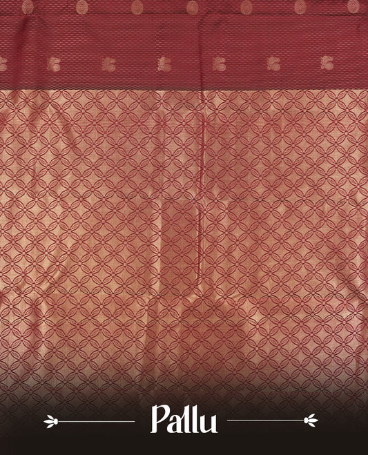 Dark maroon colour semi soft silk saree featuring a self coloured golden textured patterned body, complemented by self coloured  pallu & golden border and a matching blouse piece.