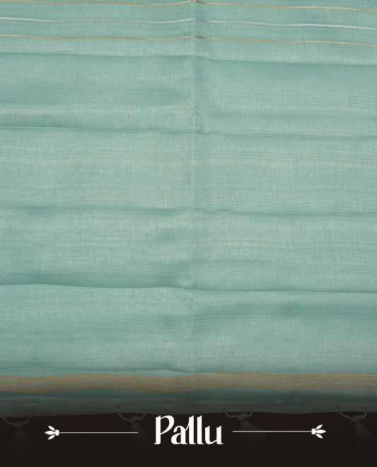 Pastel aqua colour chettinad saree highlights gold and silver zari stripes across body,  border, pallu and paired with matching blouse piece.