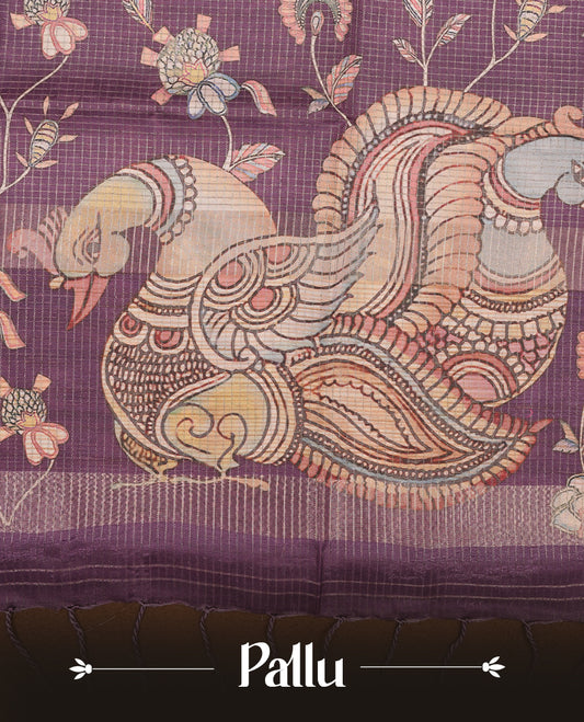 Purple colour semi-tussar silk saree featuring intricate peacock motifs on the pallu, subtle zari check pattern across the body, floral vine prints throughout, finished with tassels and paired with a matching printed blouse piece.