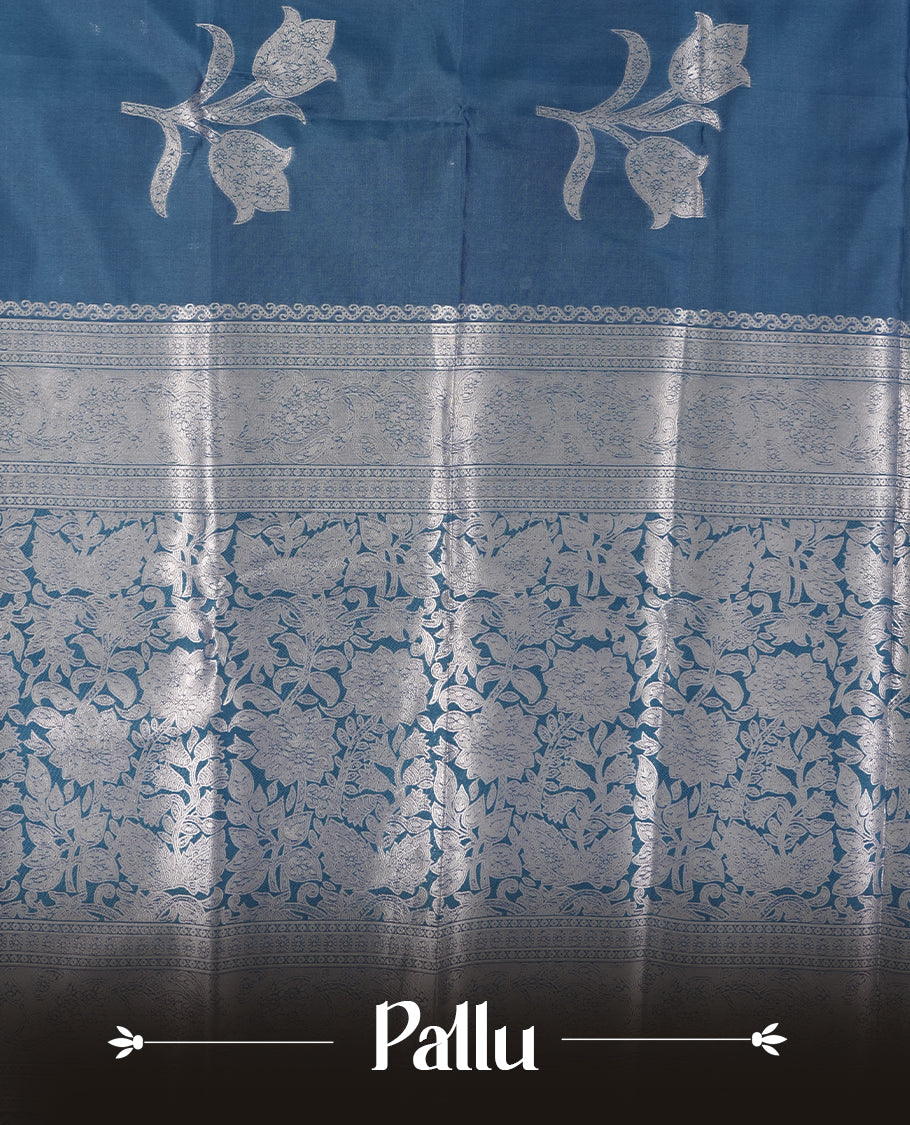 Teal Blue Semi Silk Saree with Silver Zari Floral Woven Pallu and Border, Subtle Zari Butta Motifs on the Body, Tassel Detailing, and Coordinated Blouse Piece