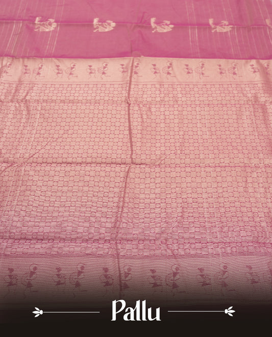 Rose Mauve and Royal Purple Colour silk cotton saree with Warli dancer pallu, subtle pinstripes and pastoral buttas on the body, floral zari border along the purple edge, and a coordinated Rose Mauve blouse with border.