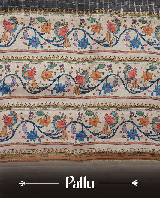 Gray colour semi tusser silk saree featuring gold zari check pattern with floral butti motifs, with contrast floral kodi & bird pattern and paired with matching blouse.