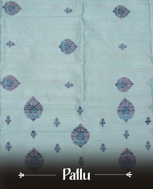 Light blue colour semi tusser silk saree featuring Floral thread embroidery across body, without border and paired with matching blouse.