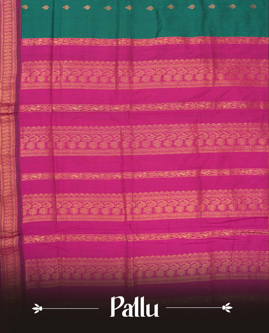 Deep Green colour Kalyani Cotton saree with golden motifs, paired with a contrasting magenta border featuring intricate zari work & Comes with a matching blouse piece.