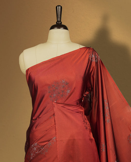 Deep copper colour semi soft silk saree adorned with delicate woven motifs on the body & Enhanced with a striking dark brown contrast zari border and elegant pallu, paired with a matching blouse.