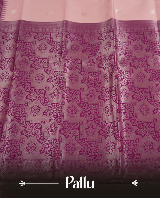 Light pink colour semi silk saree adorned with silver leaf motifs on the body, complemented by a purple pallu intricately woven with rich floral patterns border and pallu, and paired with a matching blouse