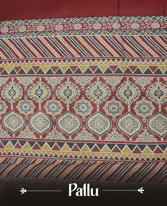 Maroon colour chanderi cotton saree with plain body, geometric tribal printed pallu with golden zari border, and diagonal striped blouse.