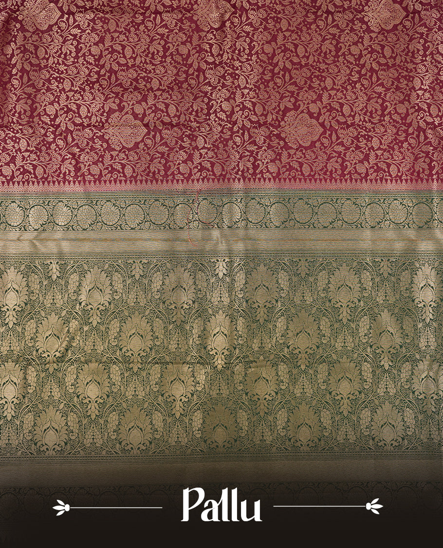 Deep Brown colour semi silk brocade saree featuring intricate Gold Floral kodi patterns across the body, complemented by a contrast rich dark green colour woven border and pallu, paired with a matching blouse.