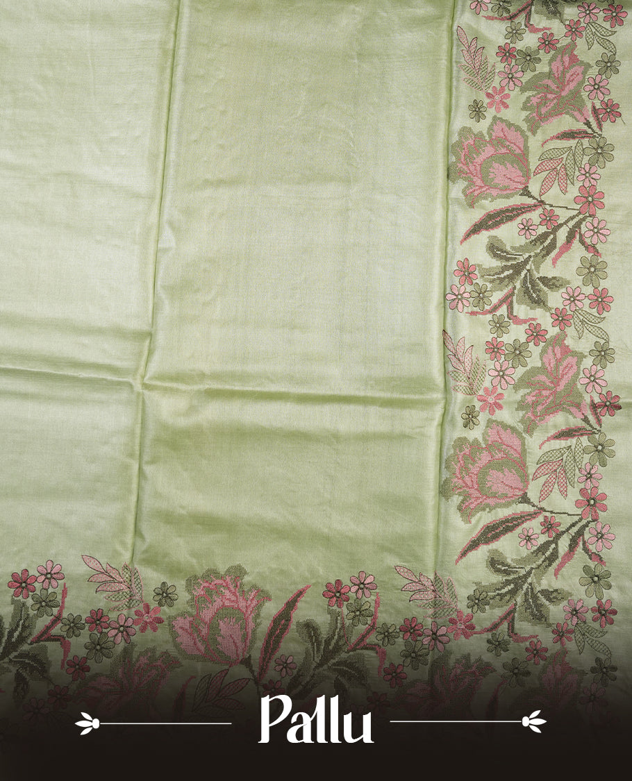 Pastel green colour Pure tusser silk saree featuring finely crafted floral thread embroidery detailing on the border, pallu and with matching blouse piece.