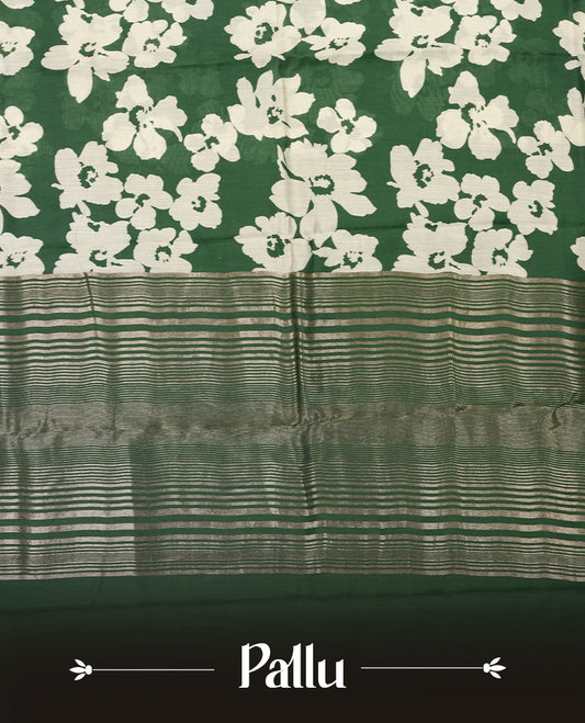 Green colour Viscos semi printed saree featuring a light golden zari border, abstract white printed motifs on the body, and comes with a matching blouse