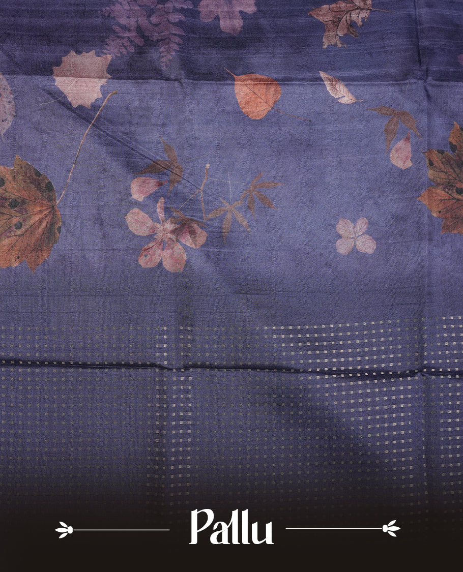 Dark blue colour tussar saree featuring woven Eco leaves printed on the body, complemented by a self colour gold zari bindi butta border & pallu, paired with a matching blouse.