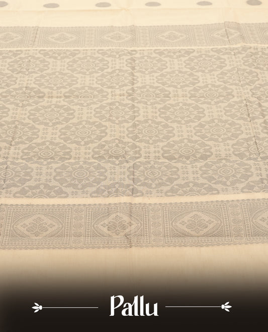 Cream colour Silk Cotton Saree with Grey Woven Polka Buttas on the Body, Minimal Grey Stripe Border, Ornate Grey Jacquard Pallu, and a Plain Ivory Blouse with Matching Grey Border
