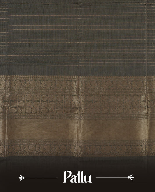 Grey colour Chettinad cotton saree featuring fine golden zari lines on the body, The contrasting black border is richly woven with intricate zari floral and paisley motifs & Comes with a matching blouse piece.