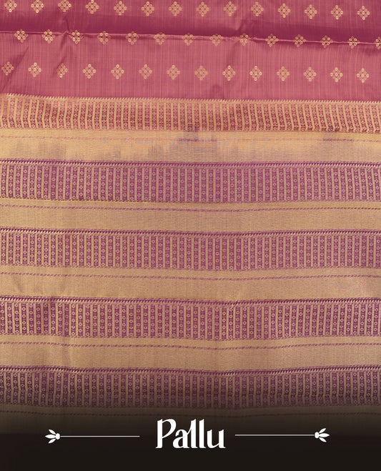 Twilight lavender colour semi soft silk saree featuring a golden textured patterned body, complemented by contrast purple with golden motifes on pallu & border and a matching blouse piece.