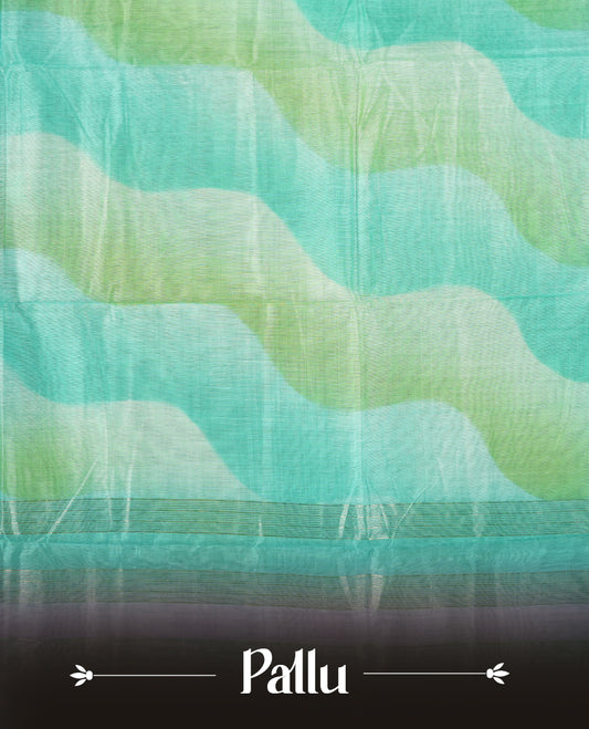 Turquoise and mint green colour mixed chanderi cotton saree with wavy ombre body, silver zari borders, lavender-pink gradient border accents, and matching turquoise blouse.