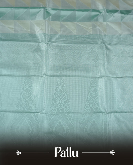 Mint & cream colour semi soft silk saree featuring a silver zari patterned body, complemented by silver zari motifes on pallu & border and a matching blouse piece.