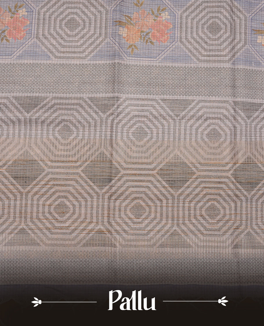 Green colour semi tussar silk saree, featuring subtle hexagonal geometric patterns across the body, a textured pallu with fine detailing, and finished with a matching blouse.