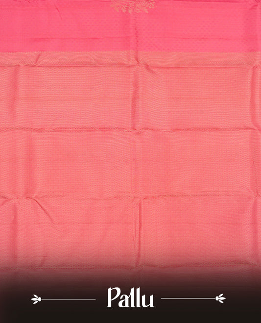 Pink colour Vasundhara silk saree adorned with all-over tiny motifs on the body, complemented by a self colour with self coloured with gold flower pattern on border and paired with a matching blouse piece.