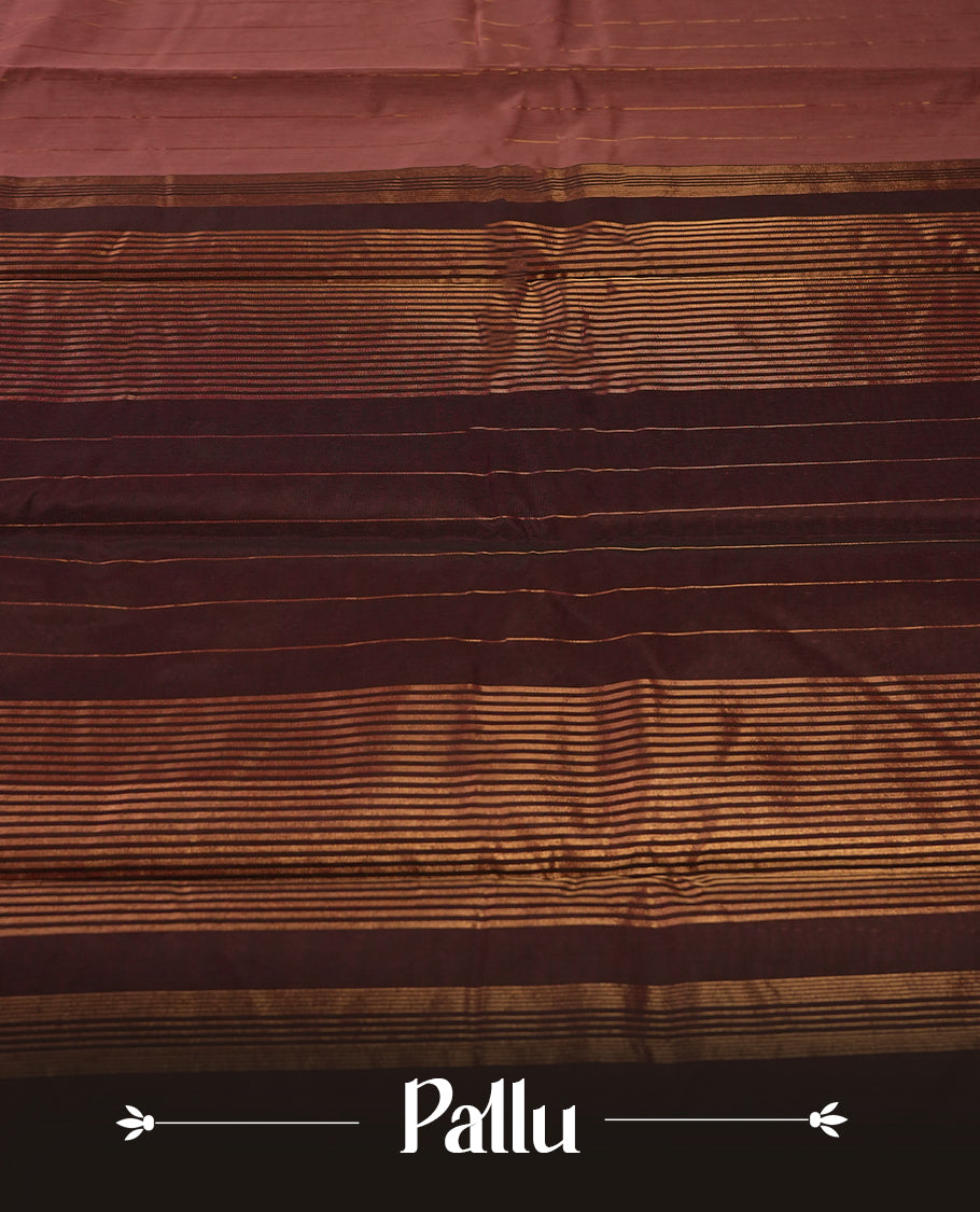 Dark onion colour silk cotton saree featuring with full of delicate vertical copper zari lines on the body & dark brown colour contrasted border, Crafted without a border for a classy touch, Comes with a matching blouse.