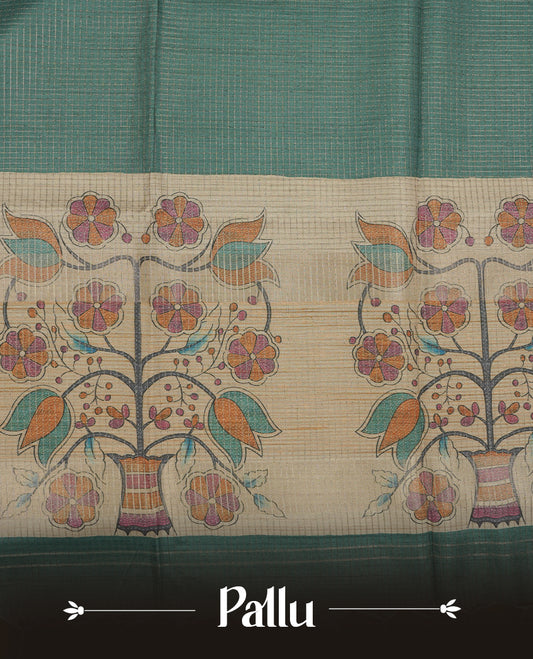 Wheat colour semi tussar silk saree featuring floral print and zari check pattern across body, contrast green colour border and pallu, paired with matching blouse piece.