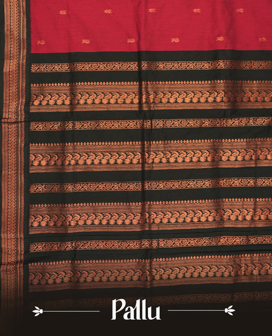 Deep maroon colour Kalyani cotton saree featuring delicate zari motifs work on the body, highlighted with an elegant contrast black zari woven border & Paired with a matching blouse.