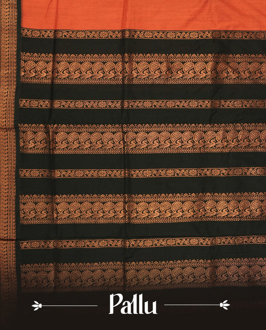 Rust orange colour Kalayani cotton saree highlighted with a black border adorned in intricate copper zari motifs, complemented by a matching pallu and blouse piece.