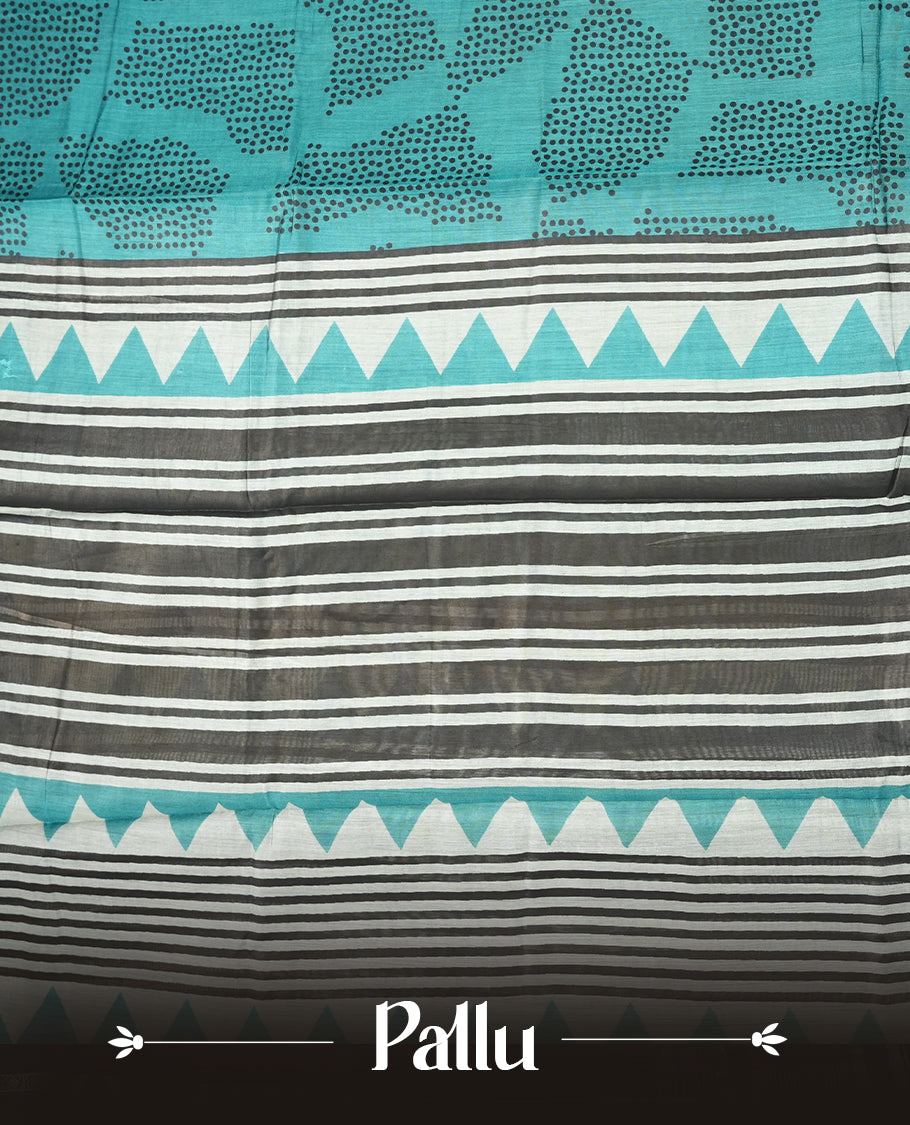 Dark teal colour mixed chanderi cotton saree with black dot motifs, multicolor striped pallu with black, off-white and turquoise triangle geometric pattern, golden zari border, and matching blouse.
