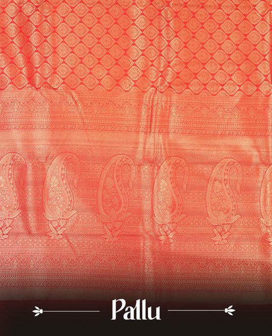 Red colour semi silk brocade saree featuring intricate Gold butta patterns across the body, complemented by a rich self colour woven border and pallu, paired with a matching blouse.