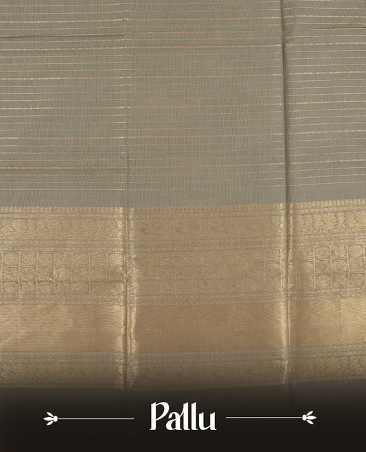 Grey colour Chettinad cotton saree adorned with subtle golden zari lines on the body, The rich ash colour border features intricate peacock and floral motifs in golden zari & Comes with a matching blouse piece.
