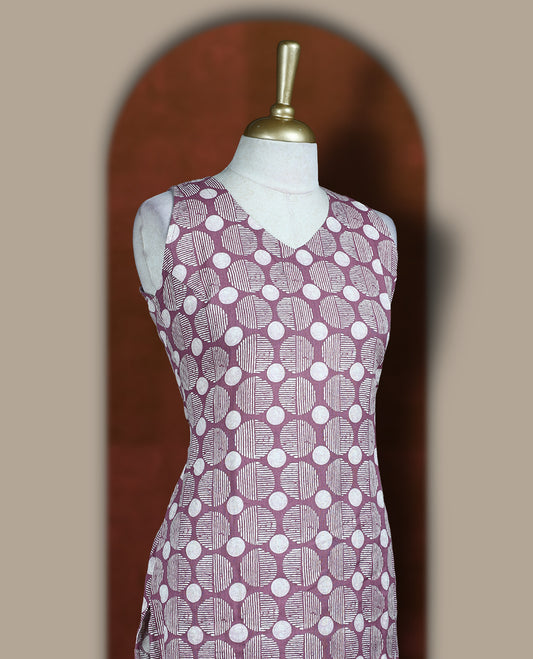 Lavender colour cotton cord set with geometric off white prints, featuring a straight kurta with stylish sleeveless with side slits, paired with coordinated bottoms.
