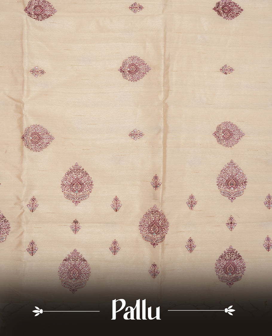 Cream colour semi tusser silk saree featuring Floral thread embroidery across body, without border and paired with matching blouse.