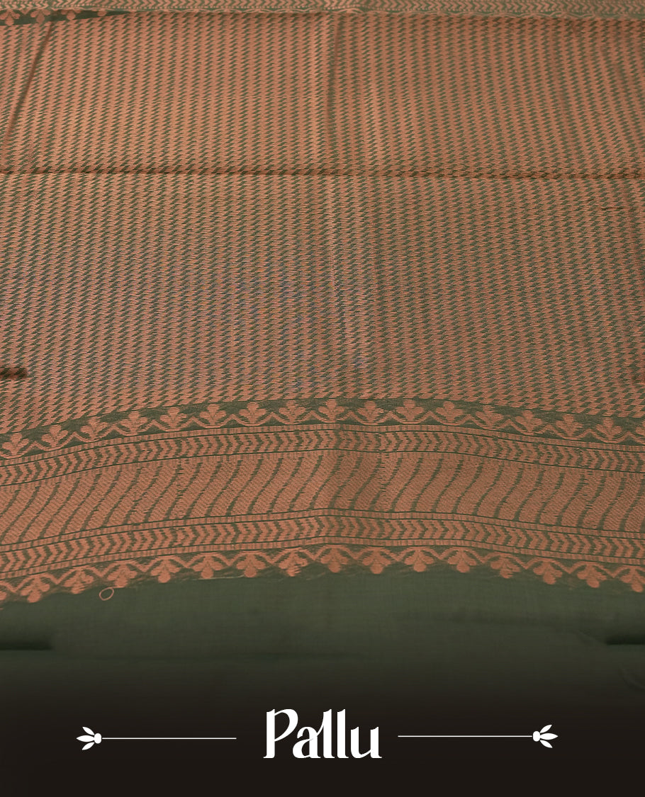 Maroon colour tissue cotton saree featuring elegant silver & copper zari motifs, a delicate zari border, and a beautifully woven pallu & Paired with a matching blouse, perfect for festive and traditional occasions.