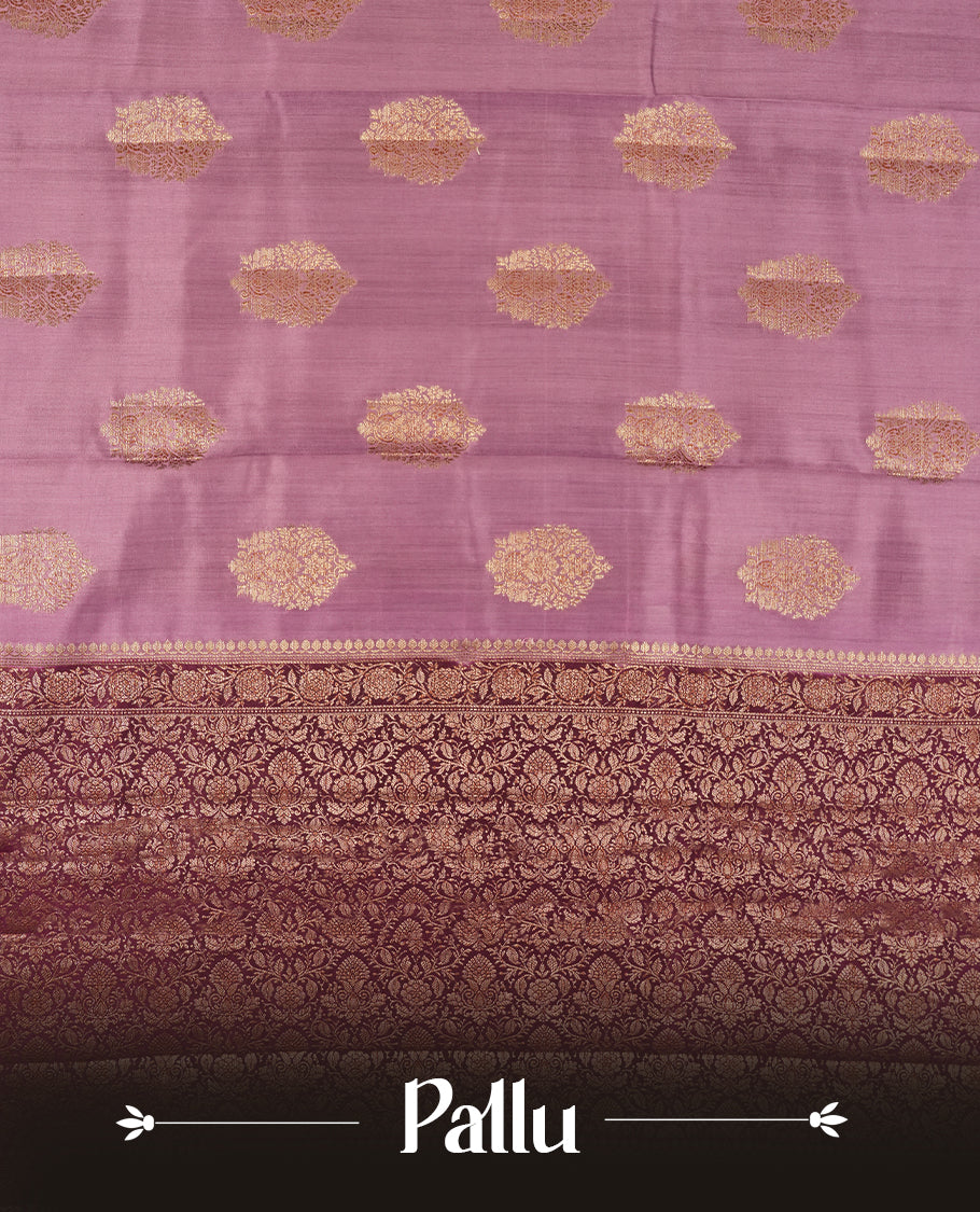 Pastel Pink Colour Banaras Soft Silk Saree with Gold Zari Textured Oval Buttas, Simple Decorative Pallu Border, Grand Pallu with Ornate Floral and Foliate Motifs in Deep Maroon and Gold Tones, and Matching Deep Maroon Blouse.