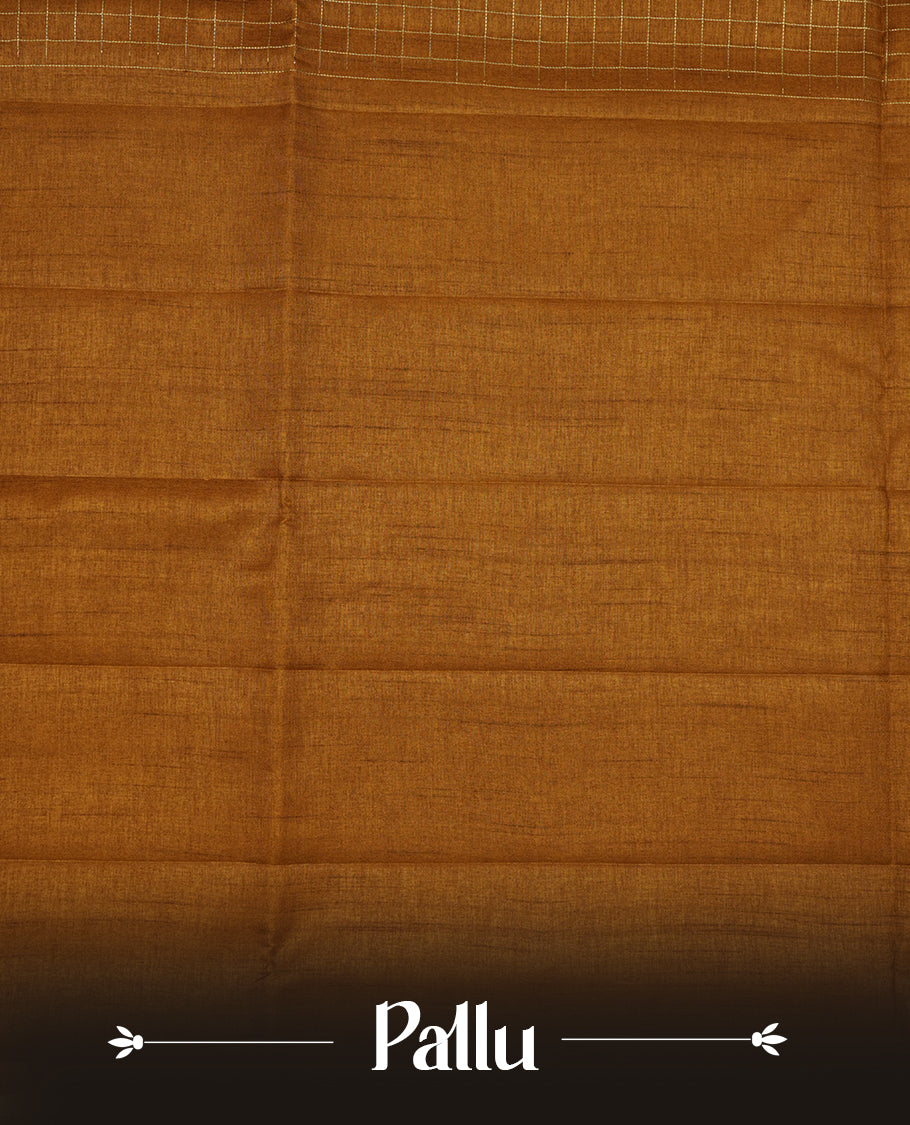 Brown colour semi Tussar saree highlights gold zari check pattern across body,  border, pallu and paired with matching blouse piece.