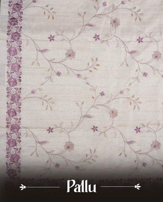 Cream colour semi tusser silk saree featuring with Lavender colour thread embroidery kodi pattern all over body, pallu, border  and paired with matching blouse piece.