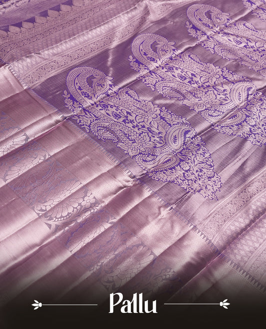 Lavender colour and Antique silver Zari Tissue Brocade Saree features intricate a navy blue coloured floral Motifs on body and A rose gold traditional border & pallu with floral patterns, paired with matching blouse